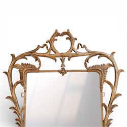 Large metal framed wall mirror, of rectangular form within an ornate openwork frame cast with scrolling foliate decoration and pierced cresting, finished in a gilt tone