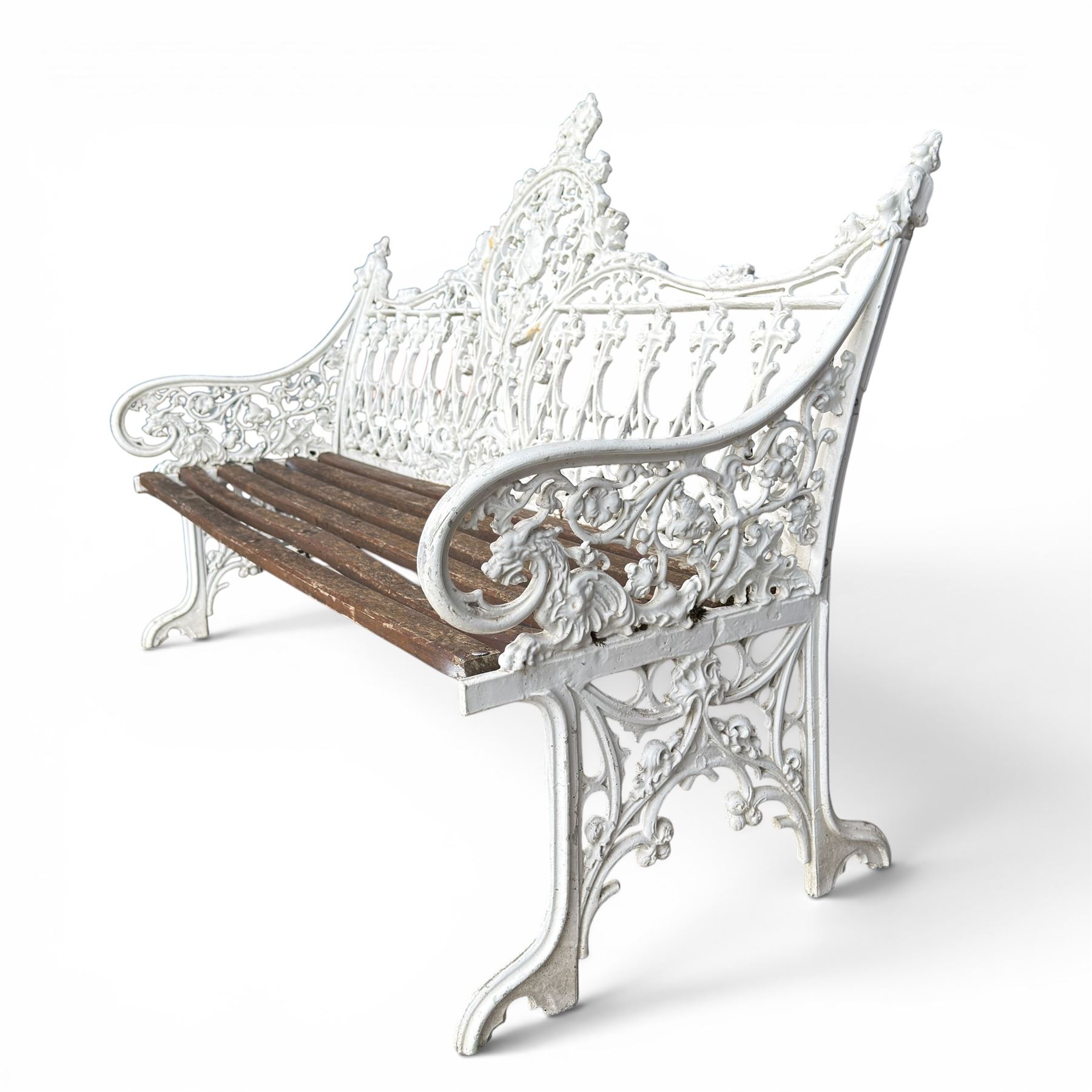 Coalbrookdale Gothic design cast iron and slatted teak garden bench, the ornate pierced back and sides of arched design, with central cartouche shield surrounded by stylised crosses and trefoils with interspersed flowerheads, the scrolled arm terminals with stylised griffon motifs and trailing fruiting vines 