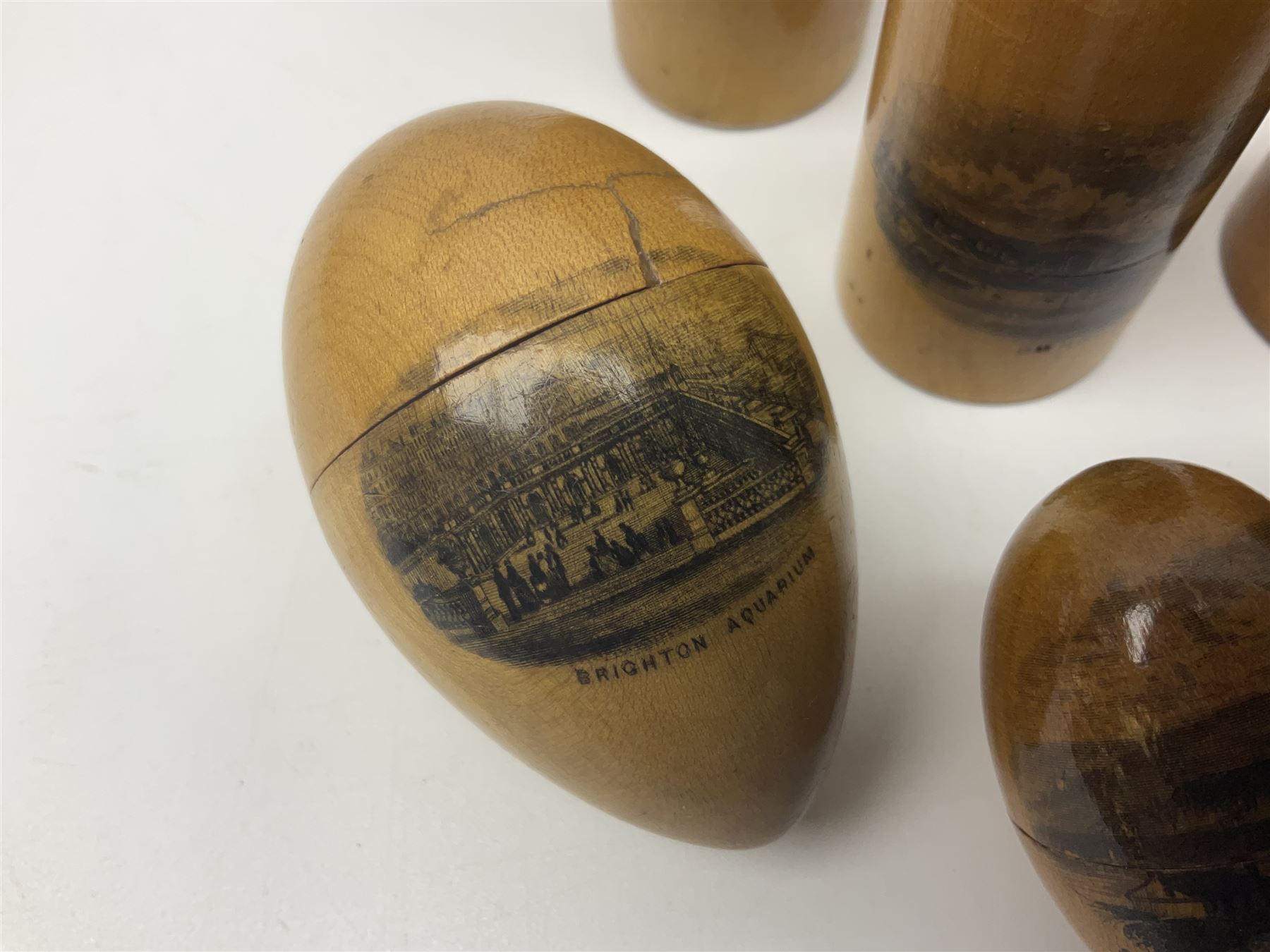 Collection of Mauchline ware relating to sewing, to include four ovoid shaped thimble cases, hinged lid thimble case and needle cases (12) 