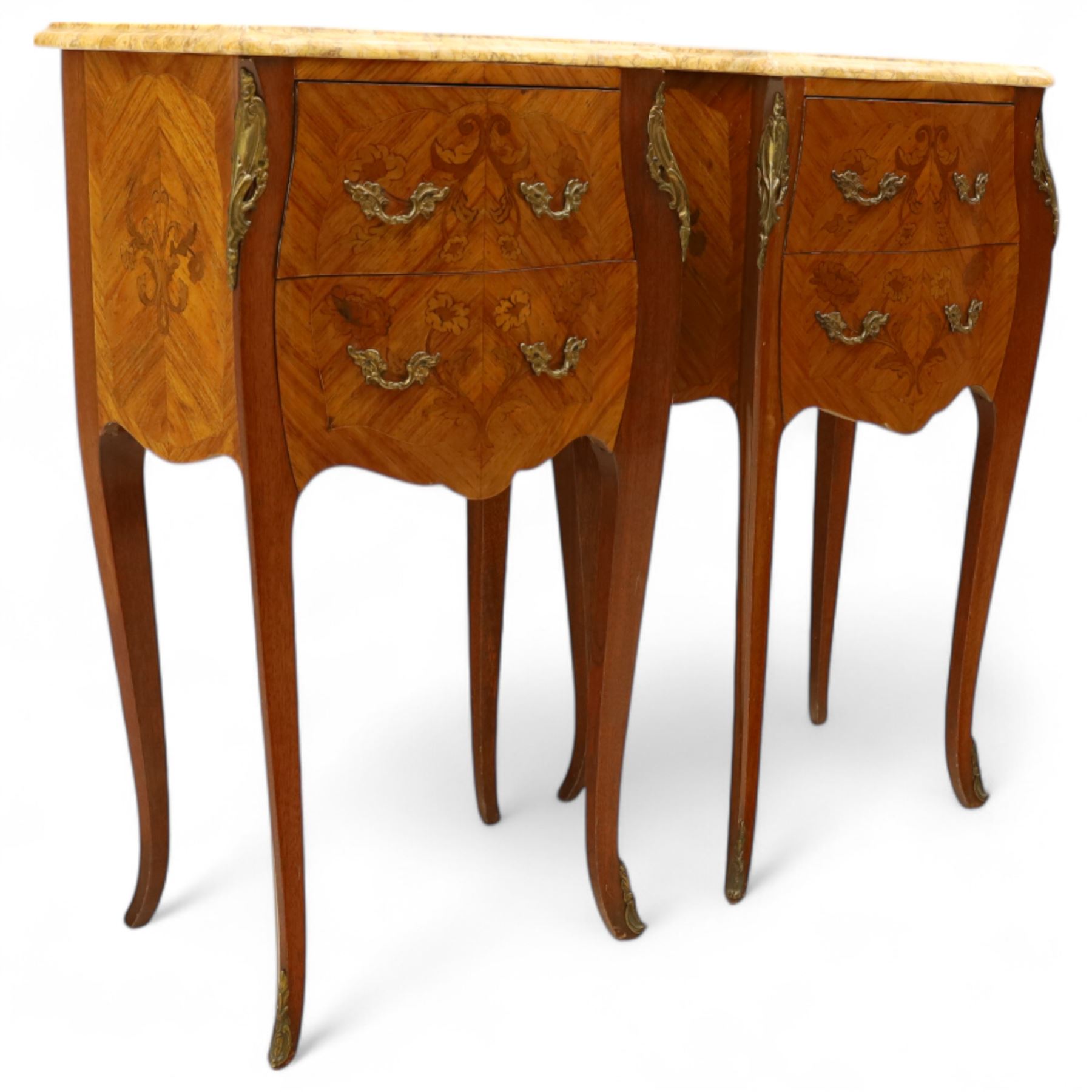 Pair of Louis XV style kingwood and marquetry bedside cabinets, the serpentine sienna marble top above two bombe fronted drawers with rococo style bronze handles and masks on slender cabriole legs terminating in bronze sabots  