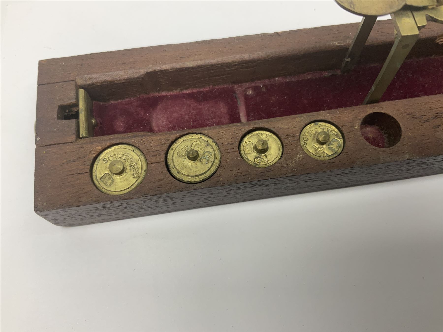 Brass sovereign scales and a part set of Georgian folding sovereign scales (one weight missing)