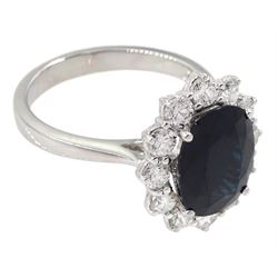 18ct white gold oval sapphire and round brilliant cut diamond cluster ring, hallmarked, sapphire approx 3.50 carat, total diamond weight approx 0.90 carat