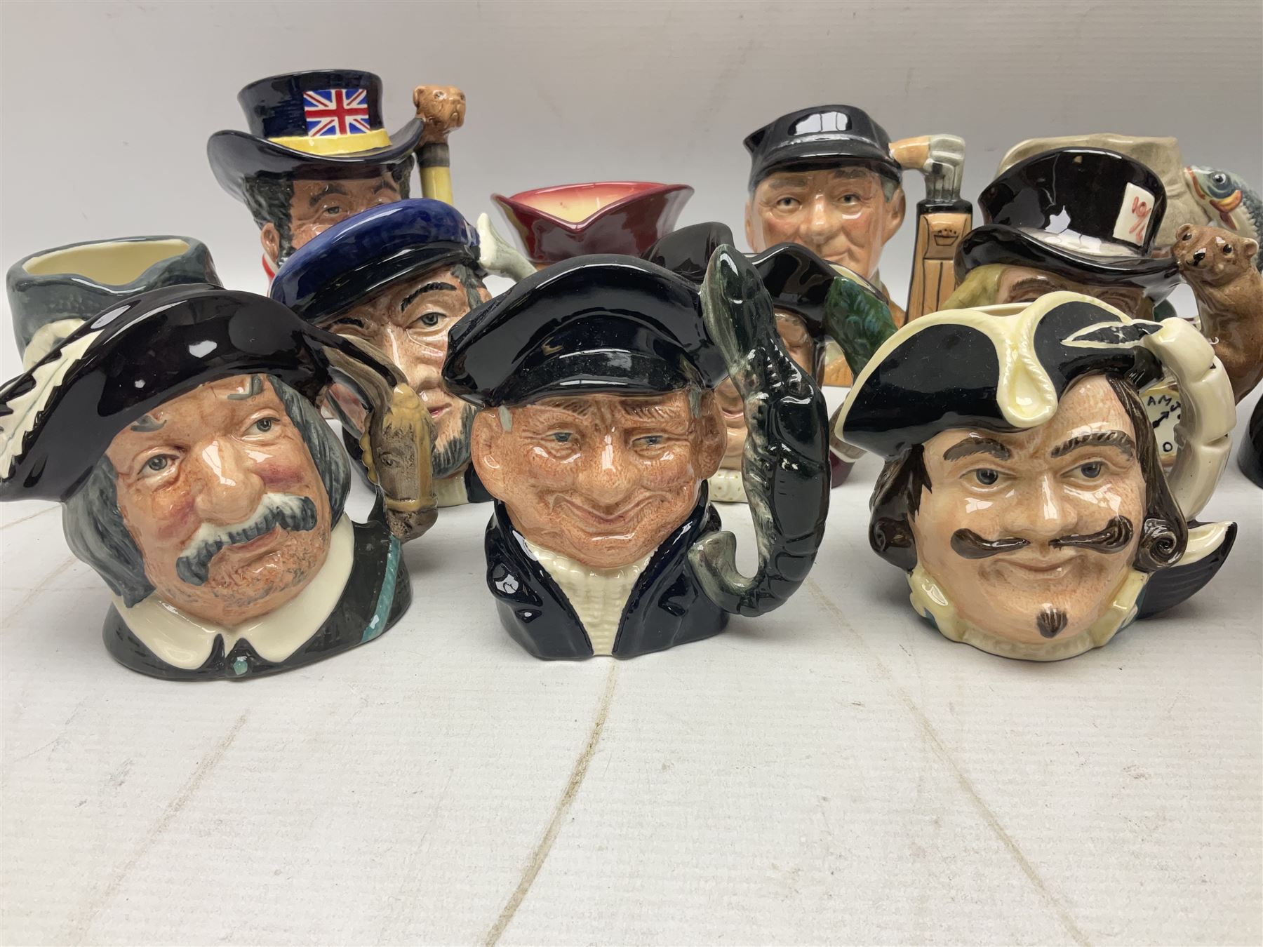 Large collection of Royal Doulton miniature character jugs, to include The Postman D6801, The London 'Bobby' D6762, Old Salt, D6554, Sir Henry Doulton D6703 etc  