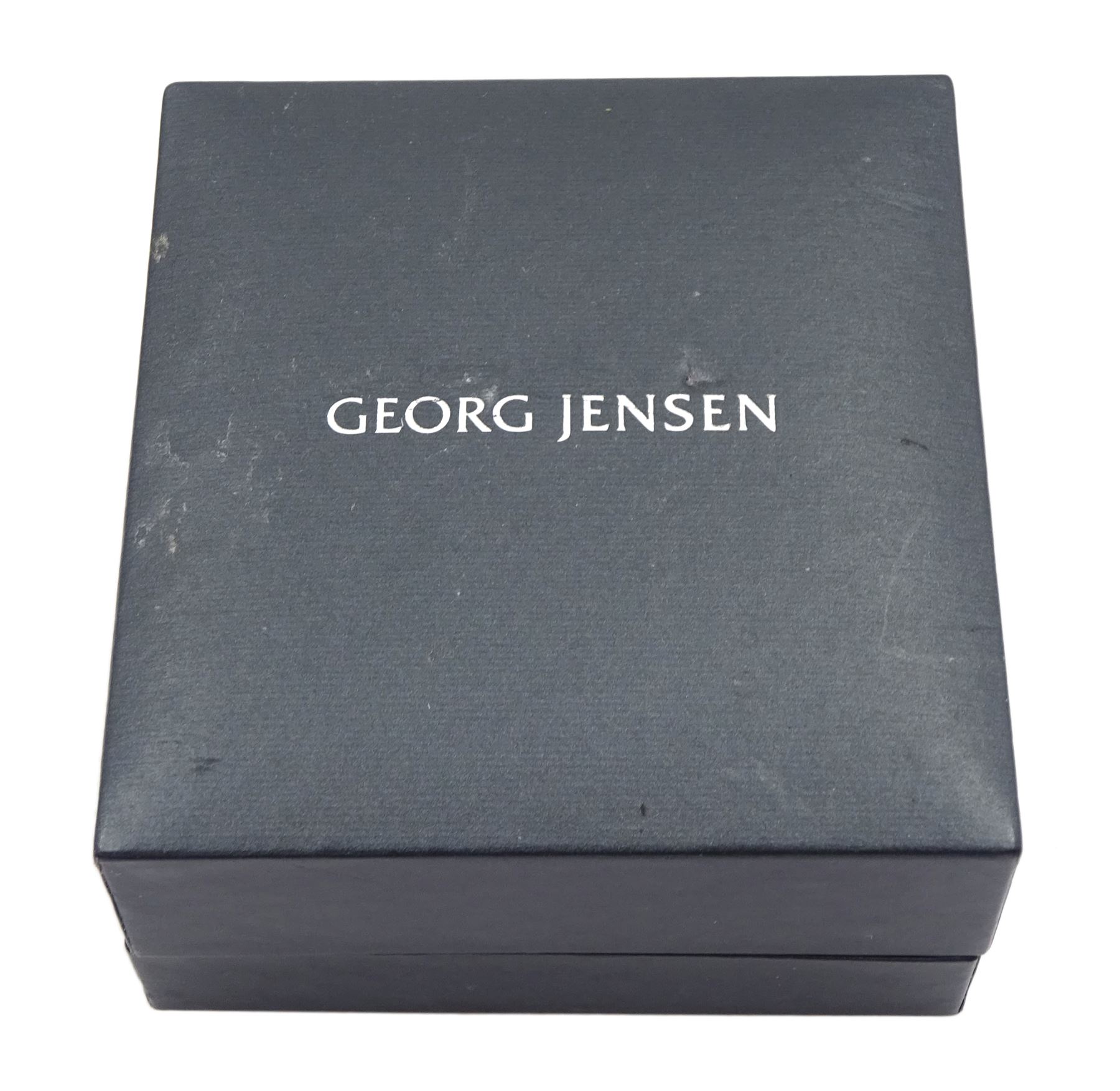 Silver-gilt white enamel daisy pendant necklace and matching pair of pendant earrings by Georg Jensen