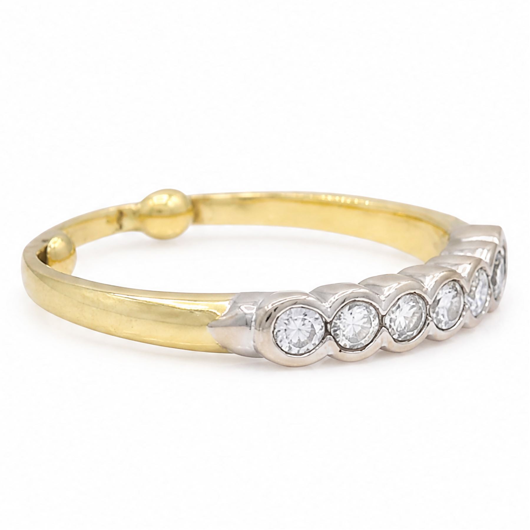 18ct gold diamond half eternity ring, bezel set with seven round brilliant cut diamonds, total diamond weight approx 0.40 carat