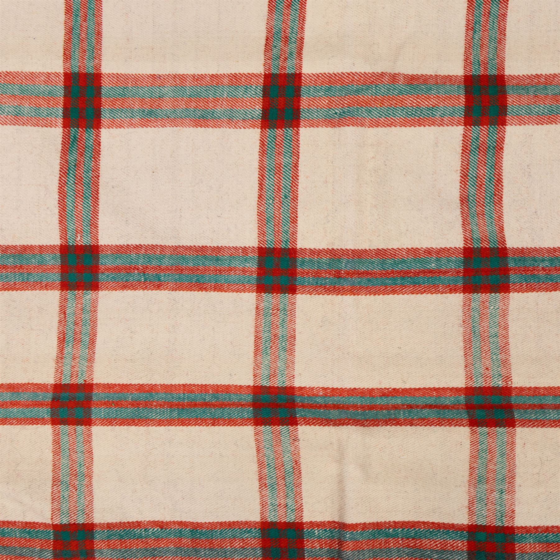 South West Persian Jajim flatweave kilim, ivory ground, woven with a bold checked and striped design in red and green, bordered by wide geometric polychromed bands decorated with circular tufts 