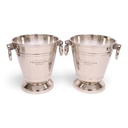 Pair champagne/ wine coolers, each with ring handles, upon a stepped circular base, H28cm