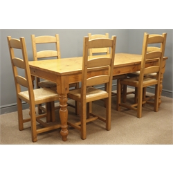 Farmhouse style solid pine rectangular dining table, turned supports, (180cm x 90cm, H76cm) and six oak ladder back chairs, reeded seats  