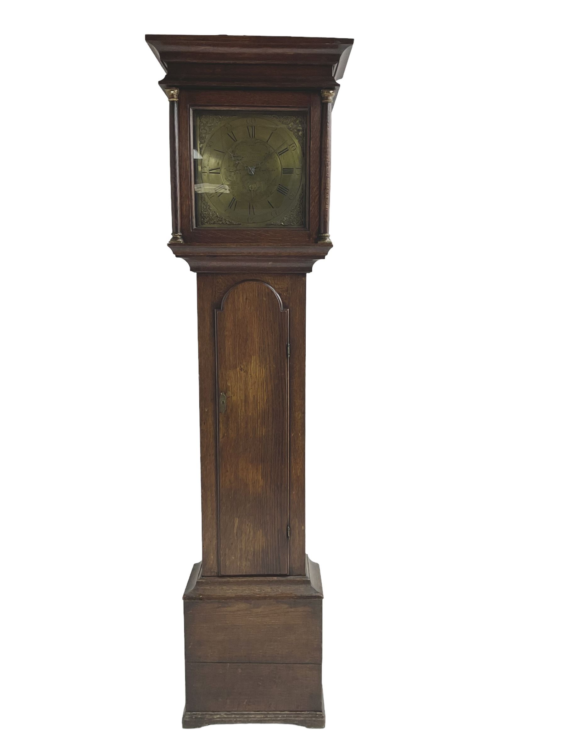 John Fletcher of Barnsley - Mid18th century 30-hour oak cased longcase clock, with a flat pediment and broad cornice, square hood door with attached pillars and gesso capitals, long trunk and conforming door with a break arch top, square plinth on a shaped base, brass dial with cast spandrels and engraved dial centre, chapter ring with Roman numerals and five minute Arabic’s, engraved calendar dial and steel hands, chain driven count wheel movement striking the hours on a bell. With pendulum and weight. The Fletcher family were a prolific family of clockmakers working in Barnsley (Yorks) during the 18th and early 19th century.