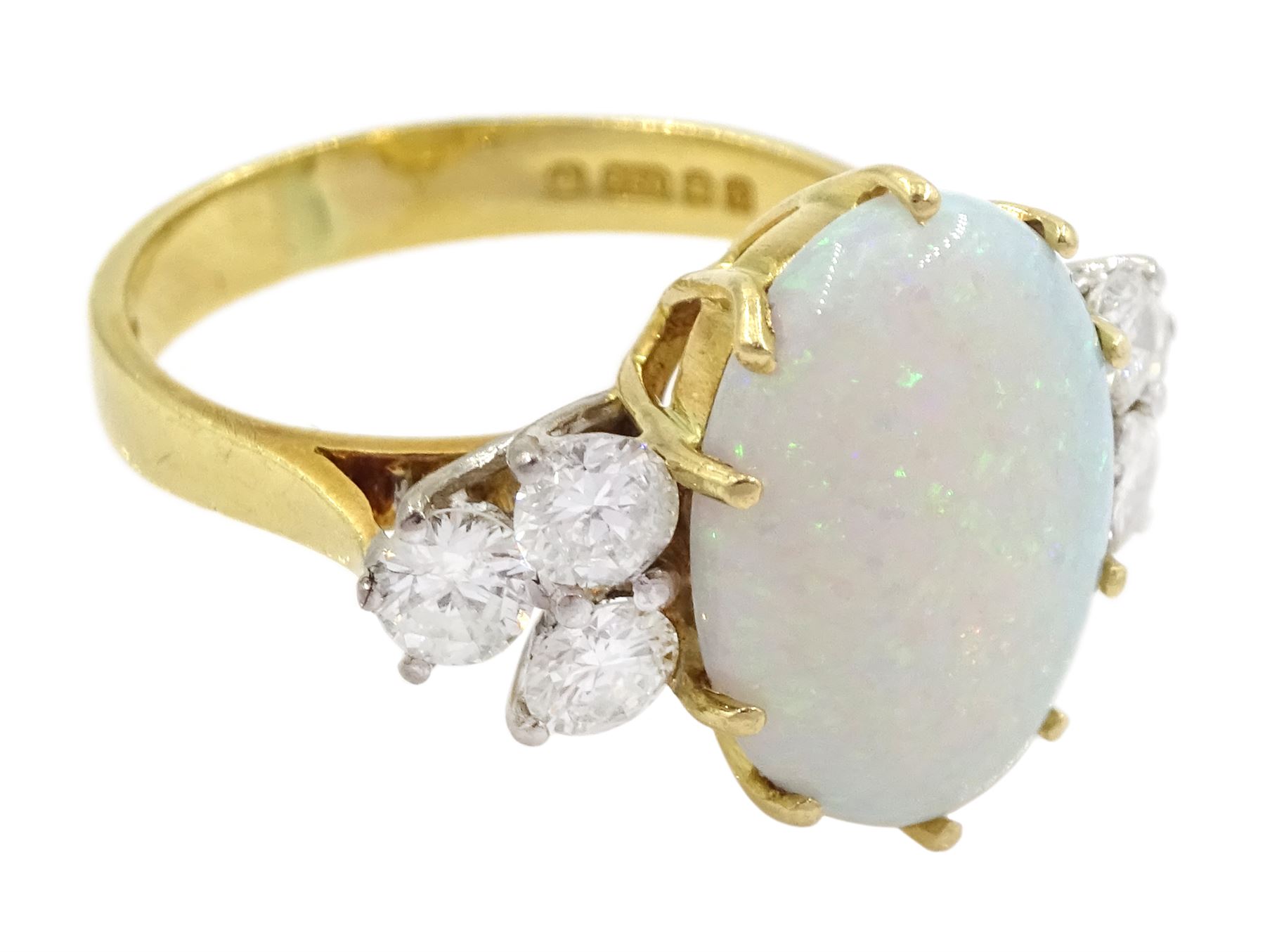 18ct gold opal and six stone round brilliant cut diamond ring, London 1977, opal approx 2.60 carat, total diamond weight approx 0.65 carat