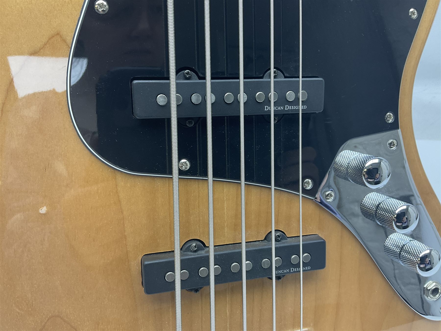 Fender Squier five-string jazz bass guitar; natural finish with Duncan Designed pick-ups; serial no.ICS11097557; L118cm