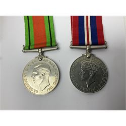 WWI pair of medals comprising British War Medal and Victory Medal awarded to 32682 Pte. W. Meadows W. Rid. R. in issue box; WWI pair of medals comprising 1914-15 Star and Victory Medal awarded to 3720 Pte. (later Cpl.) E. Petty W. York. R. with issue letter from Tank Corps; WWII group of five medals comprising 1939-45 War Medal, Defence Medal and 1939-45, Italy and Africa Stars; all with ribbons; and book of nineteen seaman's Certificates of Discharge to cook Charles Filburn 1893 - 1901 from various British ports