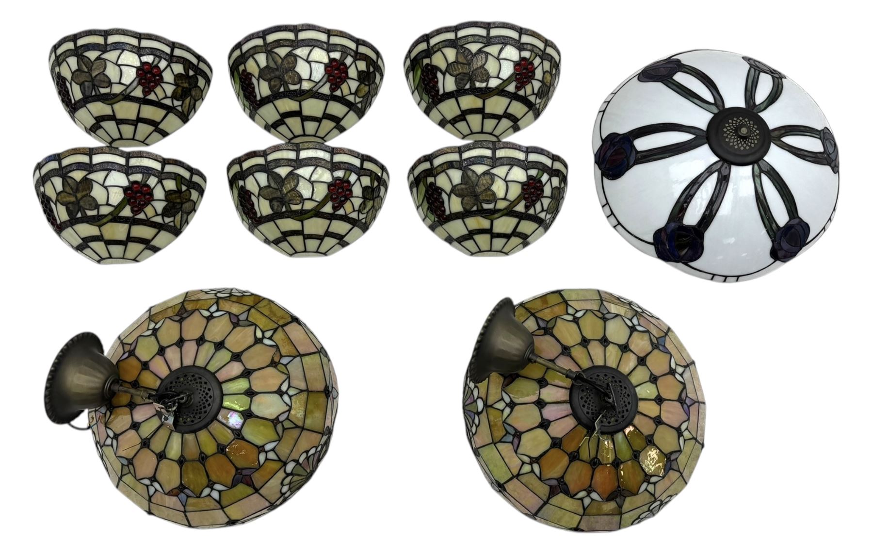 Collection of Tiffany-style light shades, to include six bowl-shaped wall-mounted fittings with floral and berry motifs and three ceiling-mounted light shades