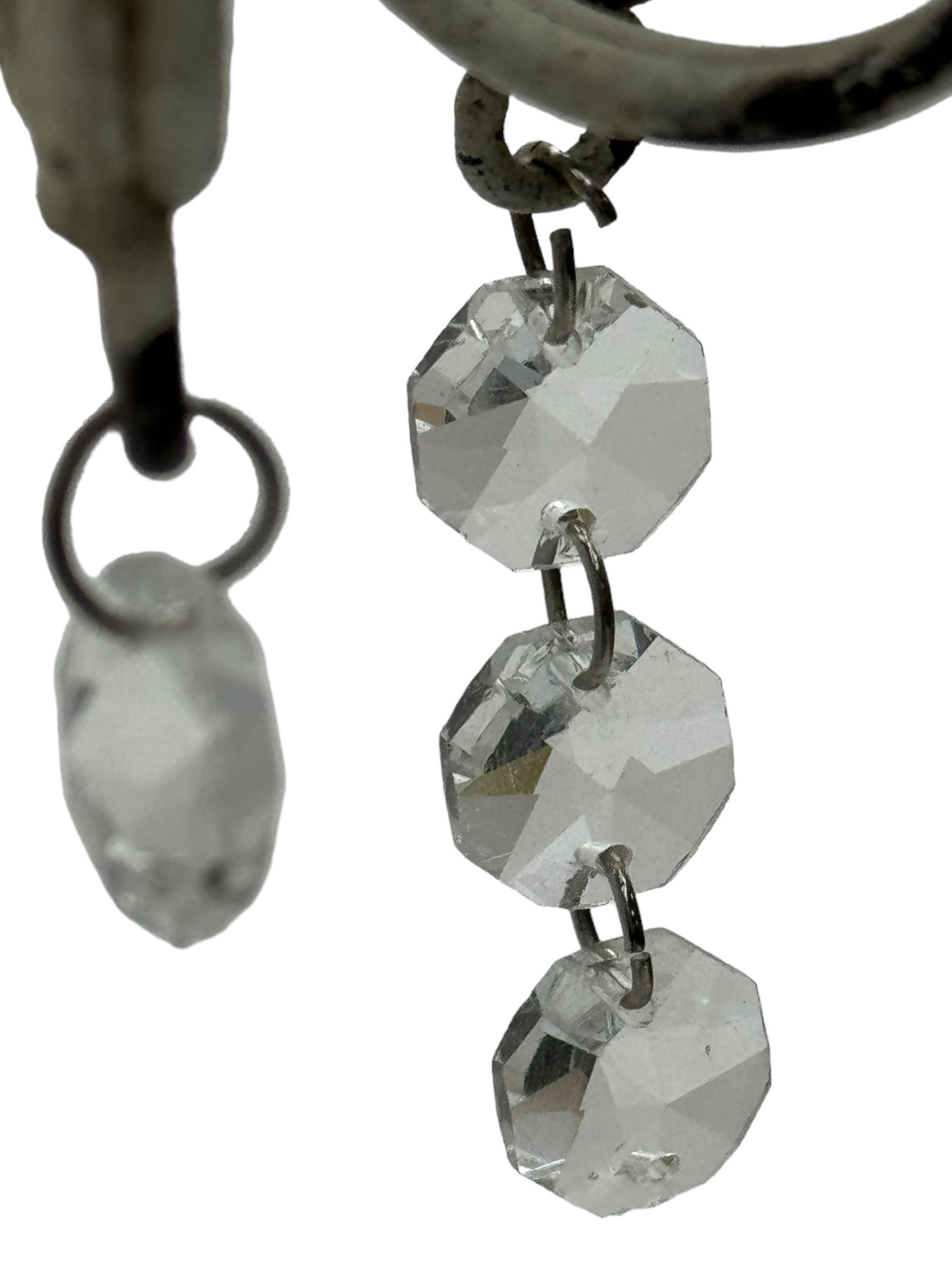 India Jane Interiors - six branch metal chandelier, the scrolled crown over circular bulbous body with six projecting branches, decorated with scroll work and glass pendants, in distressed white paint finish - ex-display/bankruptcy stock 