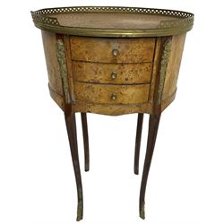 Late 20th century French design figured elm and bedside table, raised pierced gilt metal gallery over oval top, fitted with three mahogany lined drawers flanked by gilt metal mounts of female mask and foliate form, on cabriole supports