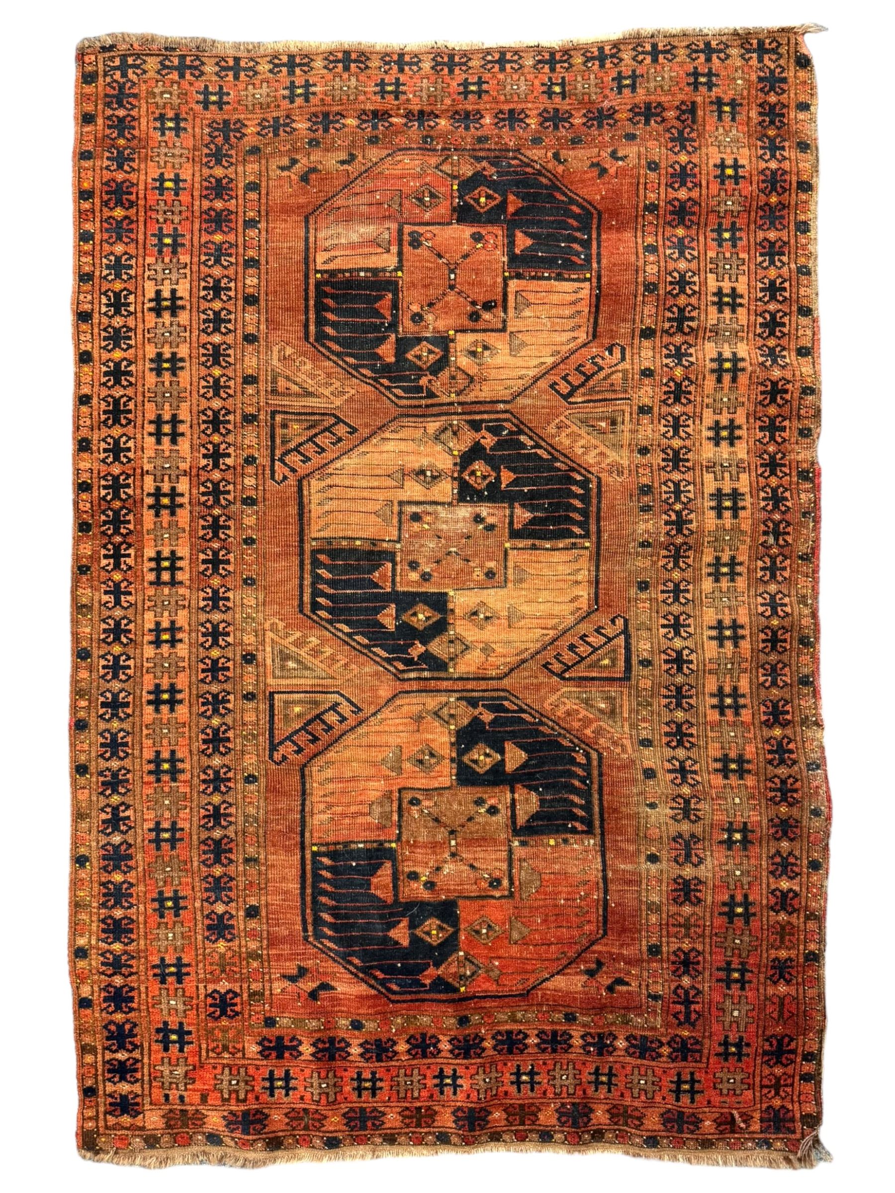 Turkish Kilim ground rug, the field with alternating horizontal bands of geometric patterns, bordered by repeating diamond motifs (145cm x 242cm); Turkish red ground rug, the field with three octagonal medallions (113cm x 172cm) (2)