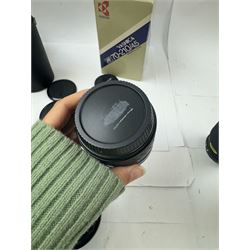 Group of camera lenses, comprising Yashica AF 70-210mm 1:4.5 58mm lens serial no. F6106983, boxed, Yashica AF 35-70mm 1:3.3-4.5 52mm Macro lens serial no. F60231147, Yashikor Aux Wide Angle 1:4 lens and a Yashikor Aux Tele-Photo 1:4 lens, Mamiya-Sekor E 1:2.8 f=28mm serial no. 13427 and a Mamiya-Sekor Zoom E 1:4 f=80-200mm lens serial no. 11271