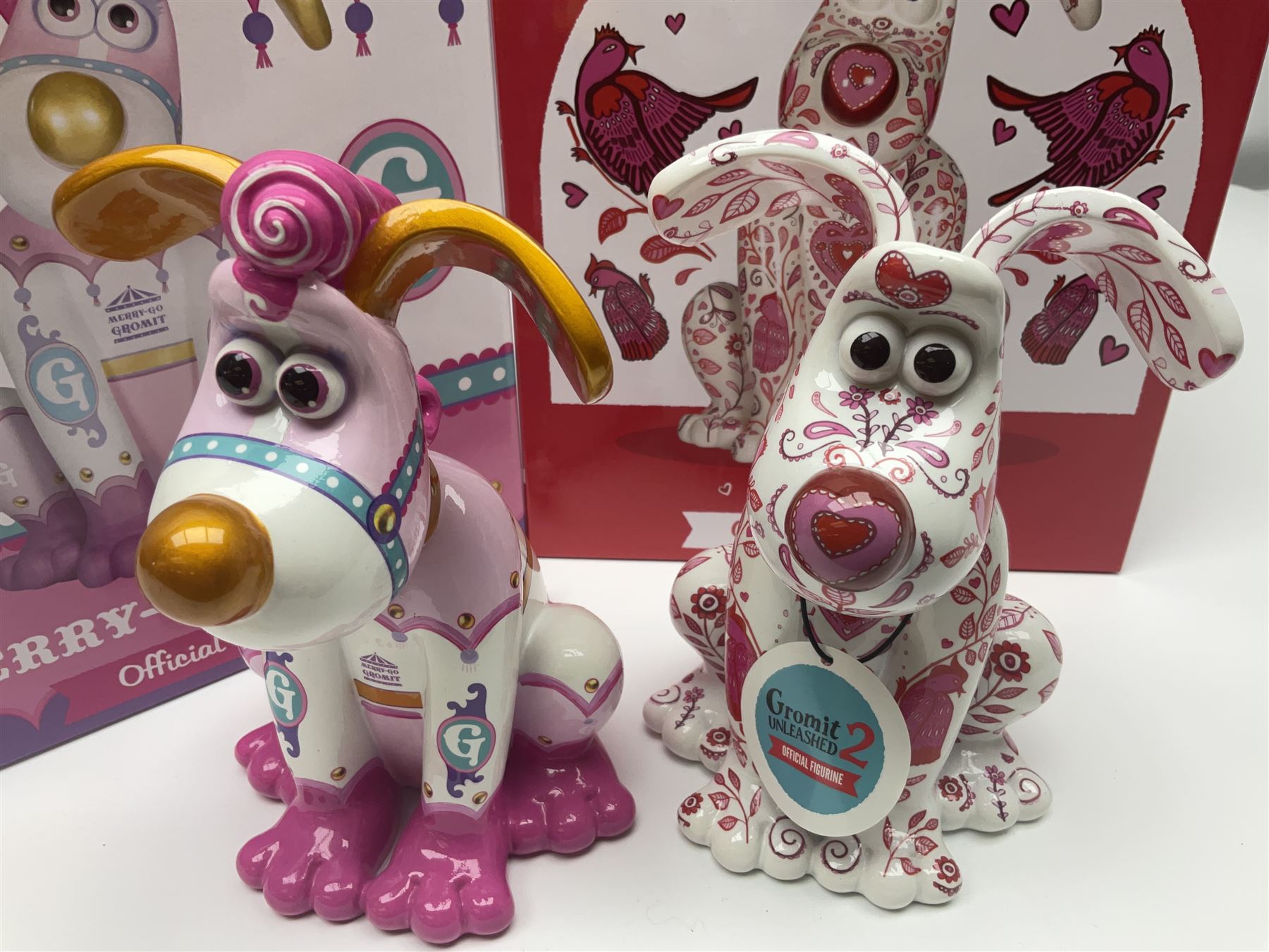Wallace & Gromit - Gromit Unleashed: two Aardman Animations The Grand Appeal 'Gromit Unleashed' figures comprising Cupid and Merry-Go Gromit, both with boxes
