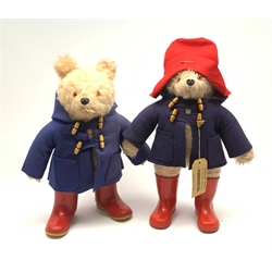 1970s Paddington Bear plush covered soft toy, probably by Gabrielle Designs, with blue duffle coat, red Dunlop wellington boots, red felt hat and label H55cm; and another similar lacking hat and label (2)