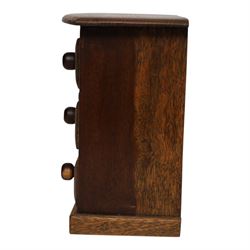 Table top chest of draws, fitted with three draws, upon a skirt base, together with another table top chest 