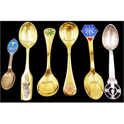 Six Danish silver and silver-gilt year spoons, including four example by Anton Michelsen, each with enamel decoration, including Christmas and other religious designs, dated between 1936 and 1984, each with maker's stamps to underside, together with two silver-gilt examples by Georg Jensen, each with enamel flowers to finials, dated 1975 and 1976, with maker's mark and Sterling Denmark stamped to underside 