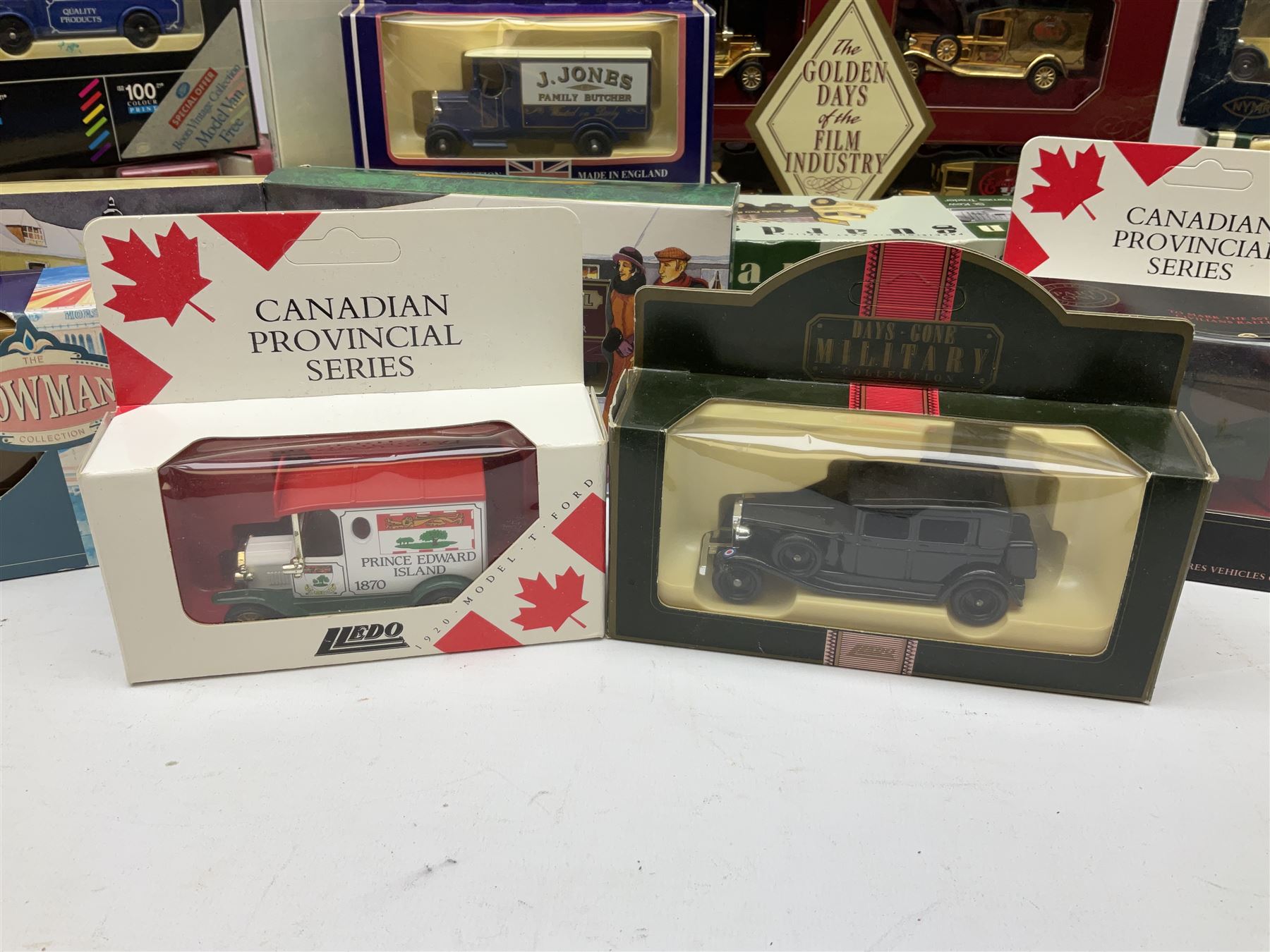 Collection of Diecast model vehicles, including Lledo The Golden Days of the Film Industry limited edition set, Lledo H Samuel boxed vehicle, and other similar examples 