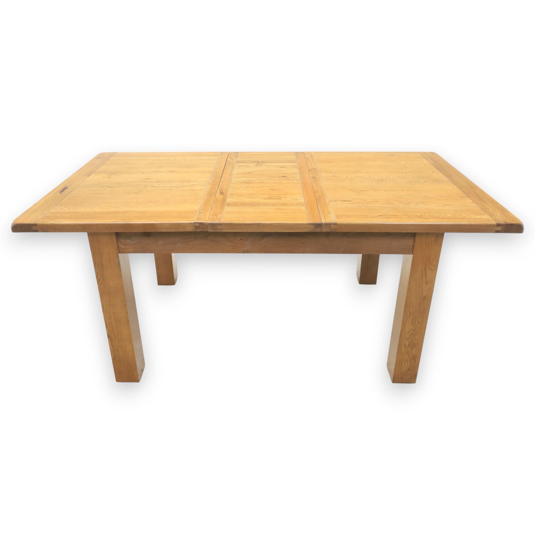 Contemporary oak extending dining table, moulded rectangular top with visible grain and inset extension leaf, pull out extending mechanism, standing on four square legs, accompanied by a set of high slat back chairs with upholstered brown faux leather seats and square tapering supports joined by stretchers