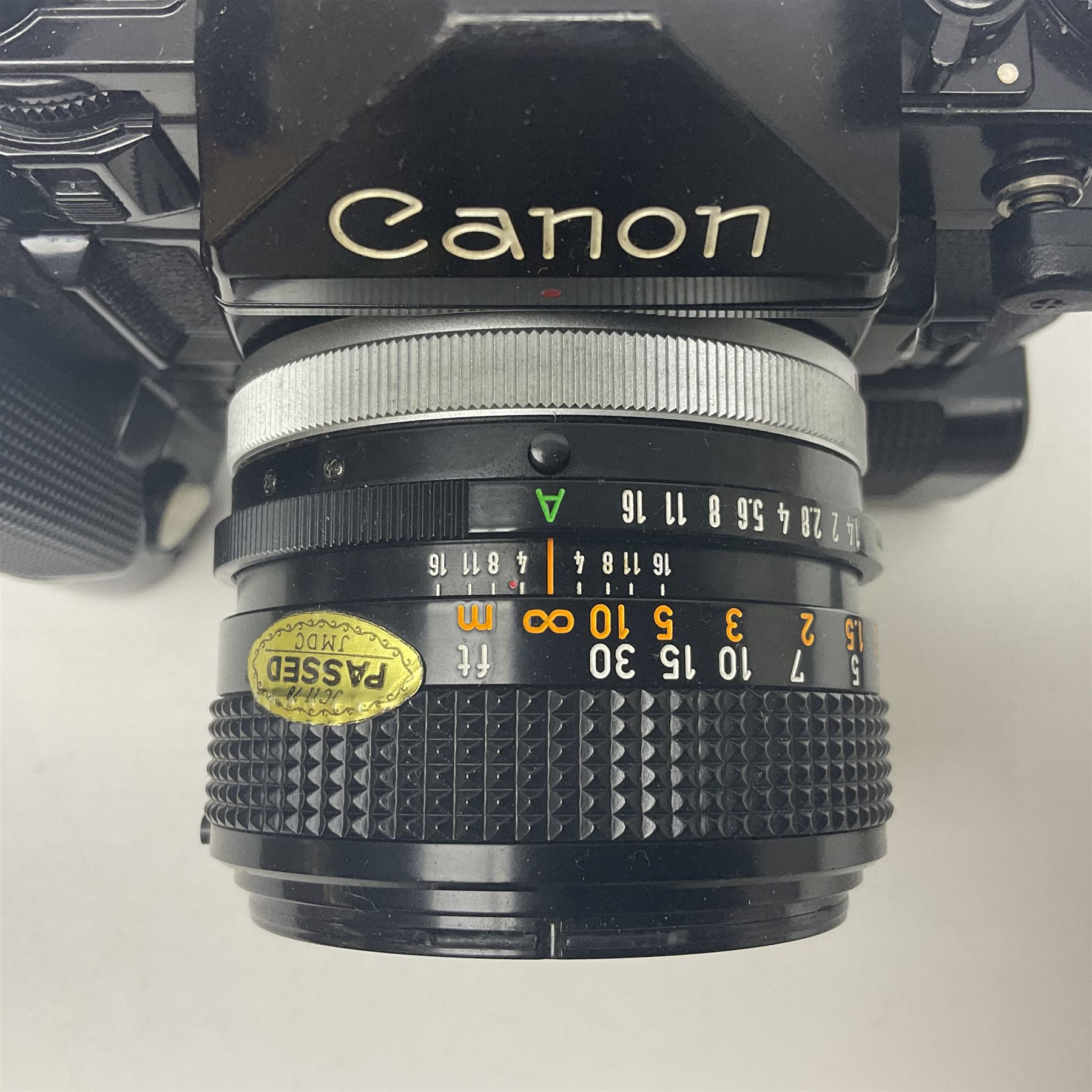 Canon A-1 camera body, serial no. 341014, with 'Canon FD 50mm 1:1.4 S.S.C.' lens, serial no. 12077119 and motor drive MA