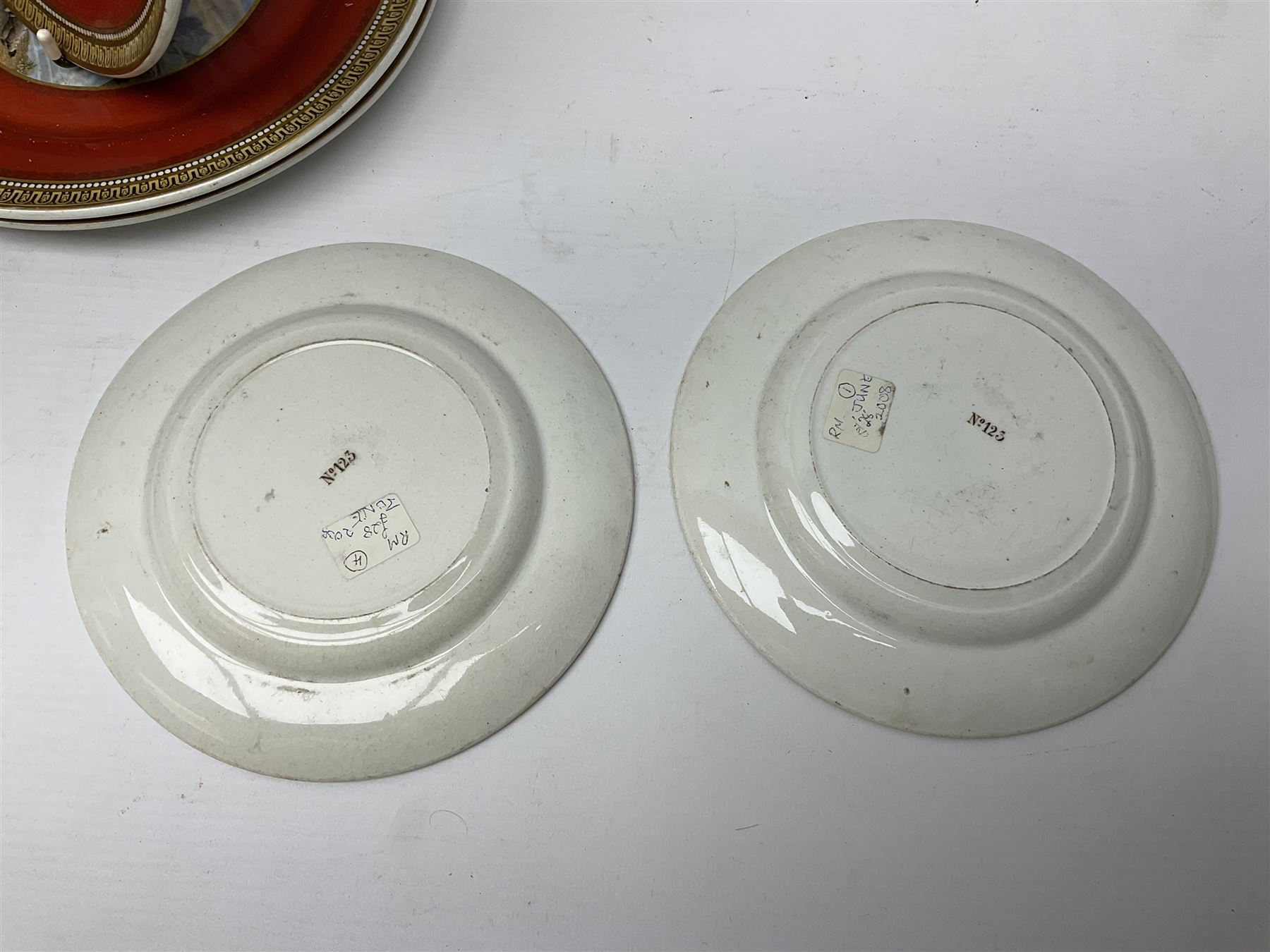 19th century Prattware table ware to include an oval footed dish decorated with a scene after Landseer 'Highland Music', retailed by James Muggleton L27.5cm, ‘The Truant’ plate after T. Webster, 'Blind Man's Buff' & 'Snap Dragon' tea plate, two side plates with malachite printed borders and others (17)