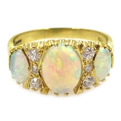  18ct gold three stone opal and six stone diamond ring, hallmarked   