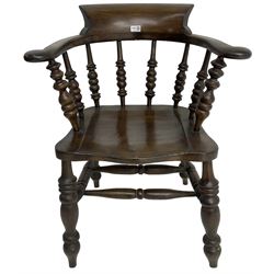 Early 20th century stained beech captains smokers bow chair, spindle tub shaped back over saddle seat, raised on turned supports united by double H-stretcher