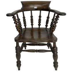 Early 20th century stained beech captains smokers bow chair, spindle tub shaped back over saddle seat, raised on turned supports united by double H-stretcher