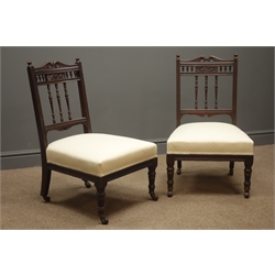  Pair Edwardian walnut framed nursing chairs, carved cresting rails, upholstered seats, turned supports  