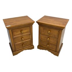 Pair of contemporary cherry wood bedside chests, rectangular top and projecting moulded cornice over three drawers, on plinth base with shaped apron