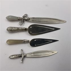 Four novelty silver bookmarks, including two modelled as swords, one with agate handle, and two modelled as cake slices, one with a mother of pearl handle, all hallmarked 