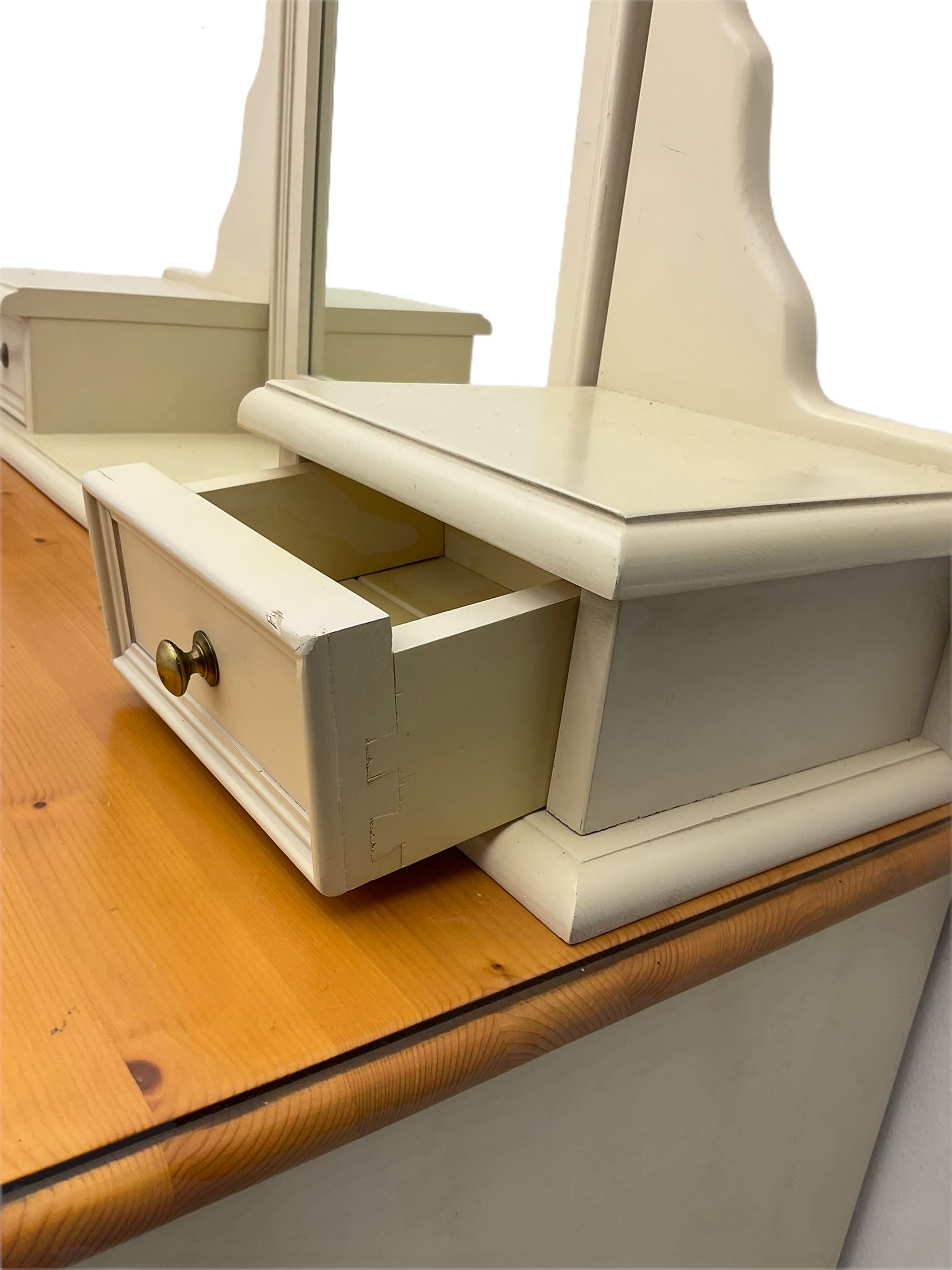 Laura Ashley pine and cream finish vanity chest, fitted with two short and three long drawers, swing mirror back