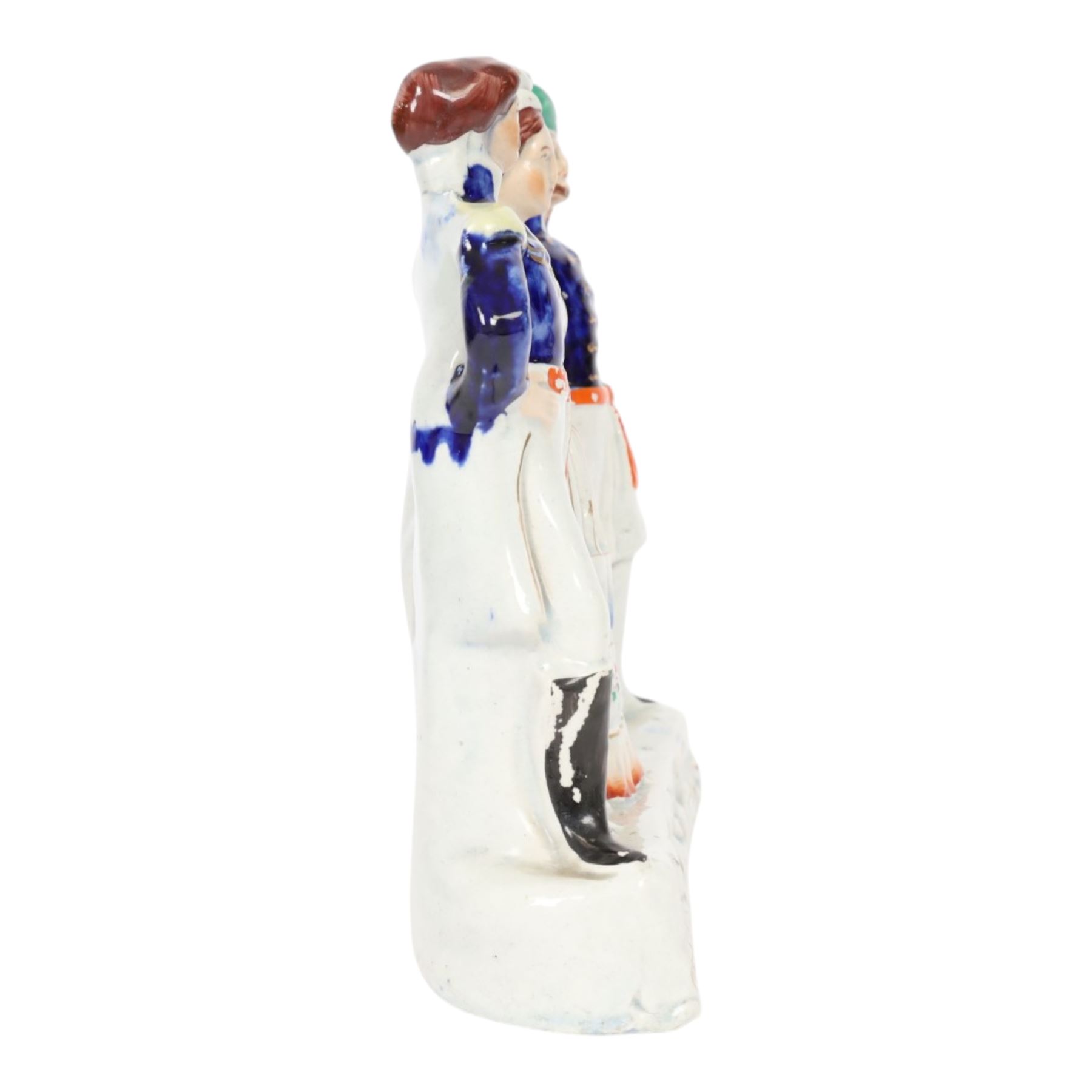 Rare mid 19th century Staffordshire figure group, Napoleon III, Victoria and Abdul-Medjid, made to commemorate the alliance of the three nations in the Crimean War, Victoria stands central with Napoleon in military uniform to her right, and the Sultan to her left, upon a titled base, H23.5cm