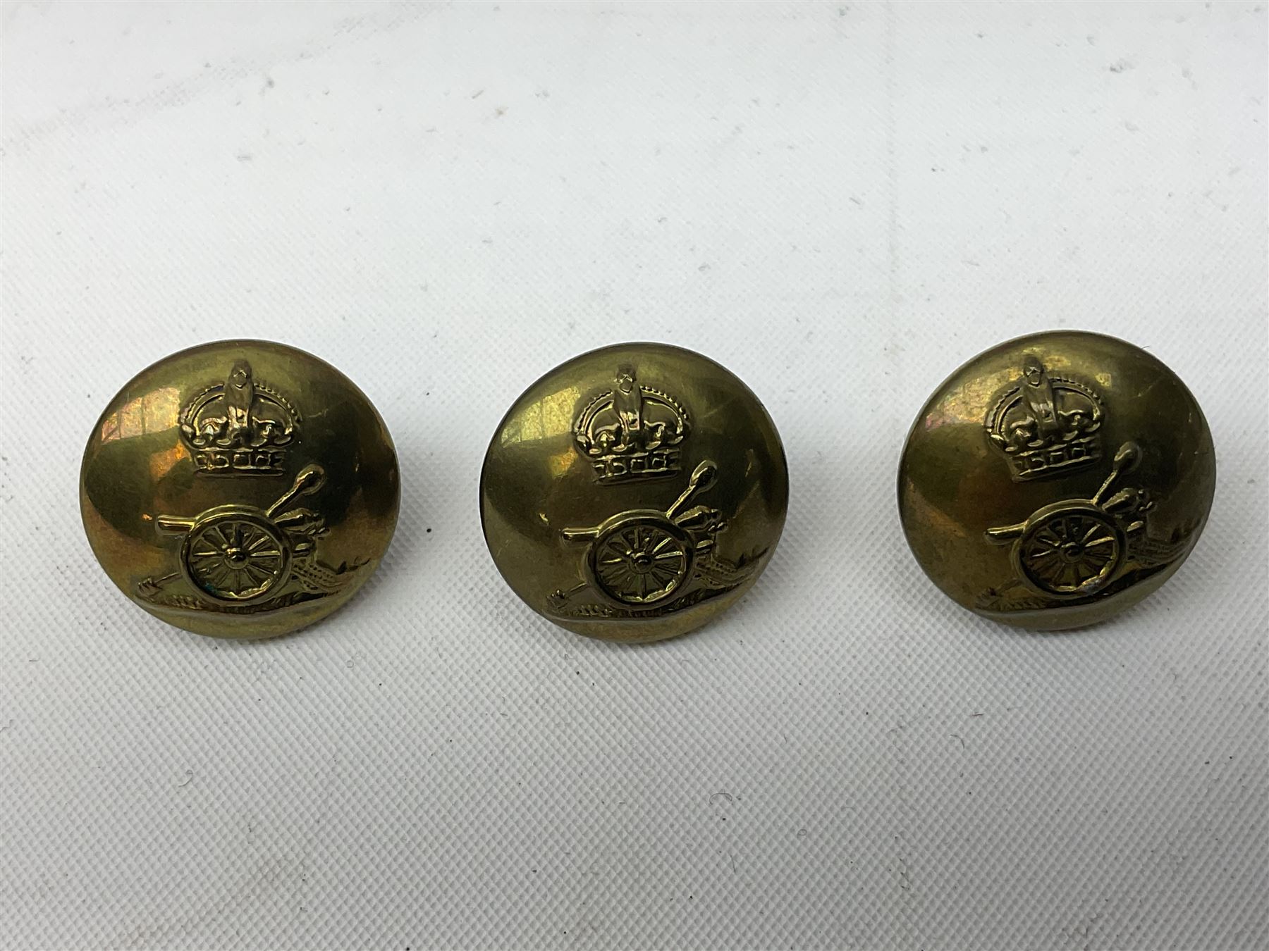 Royal Artillery 9ct gold and enamel sweetheart brooch in original box; together with Royal Artillery shoulder title, brass badges and buttons; and WW2 Defence Medal in issue box to 232775 addressed to Mrs. J.M. Morgan