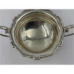 1920s five-piece silver tea service, comprising teapot, coffee pot, hot water pot, twin handled open sucrier and milk jug, each of squat circular form with shaped rim, the teapot, coffee pot and hot water pot each with ebonised handle and finial, the sucrier and milk jug with acanthus capped scroll handles, all upon circular foot, hallmarked R F Mosley & Co, Sheffield 1926 & 1927, tallest H24cm