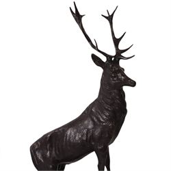 After Jules Moigniez (French 1835-1894): Pair of bronze stag figures on marble bases, each modelled alert standing on moulded rocky plinth on shaped marble bases, H74cm