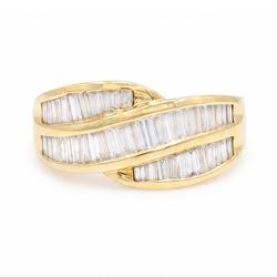 18ct gold diamond crossover ring, channel set with three rows of baguette cut diamonds, 1994