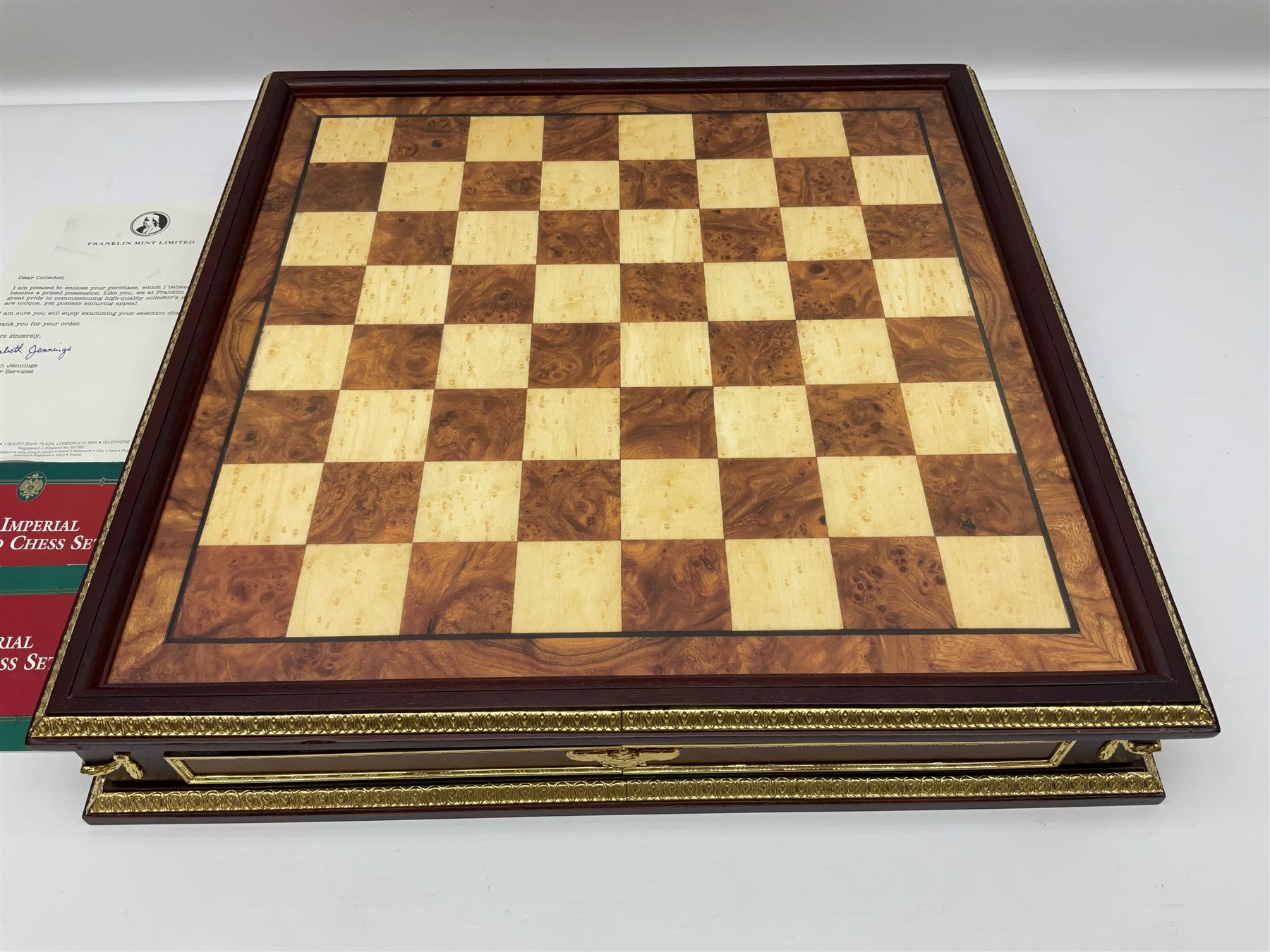 Franklin Mint House of Faberge 'The Imperial Jewelled Chess Set', to include set of chess pieces with malachite finish and a set with carnelian finish and a hardwood chess board