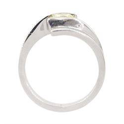Platinum diamond ring, tension set with a single princess cut fancy yellow diamond of approx 0.60 carat, hallmarked
