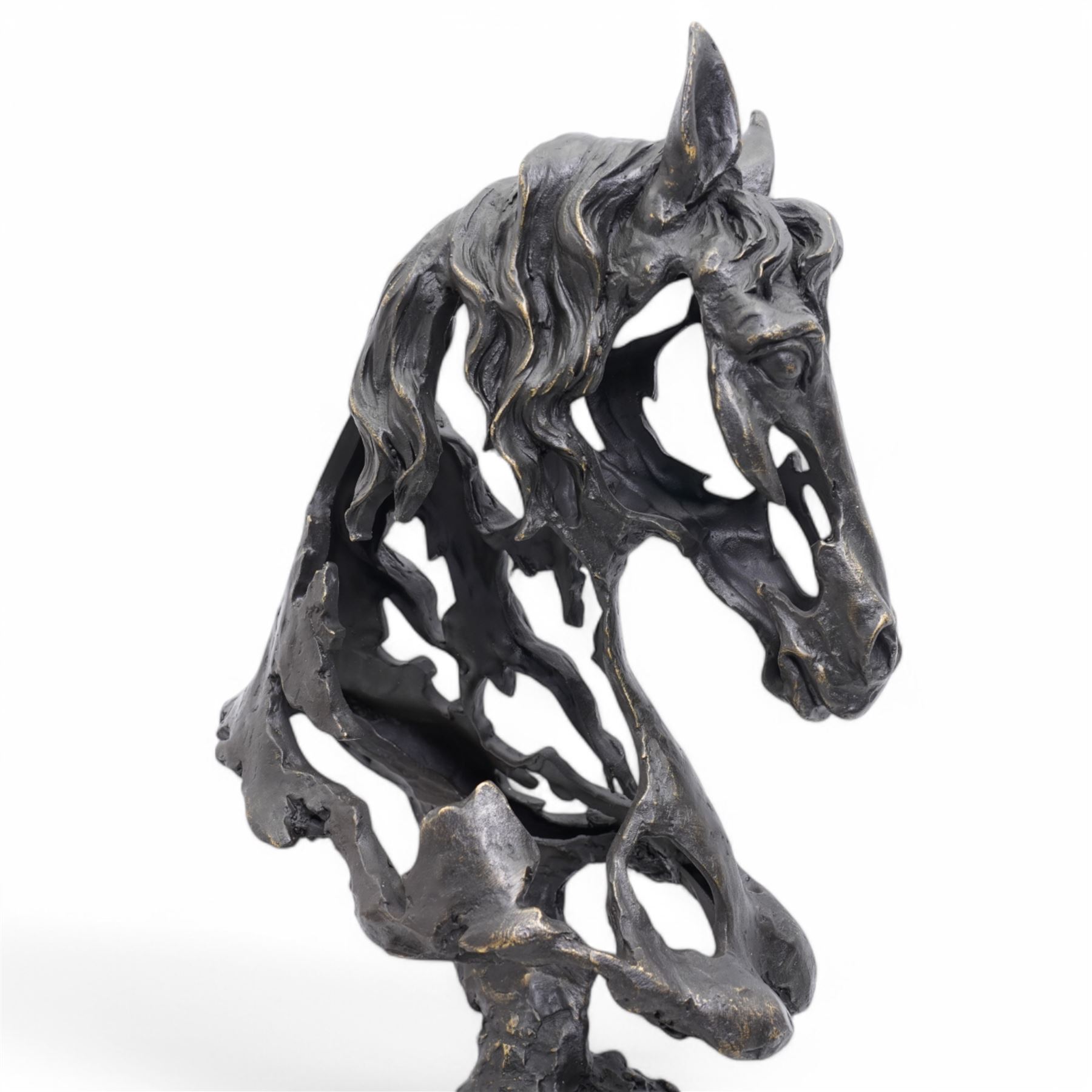 Bronze figure, modelled as a stylised horses head, upon a square marble plinth, signed and bearing foundry mark, overall H41cm