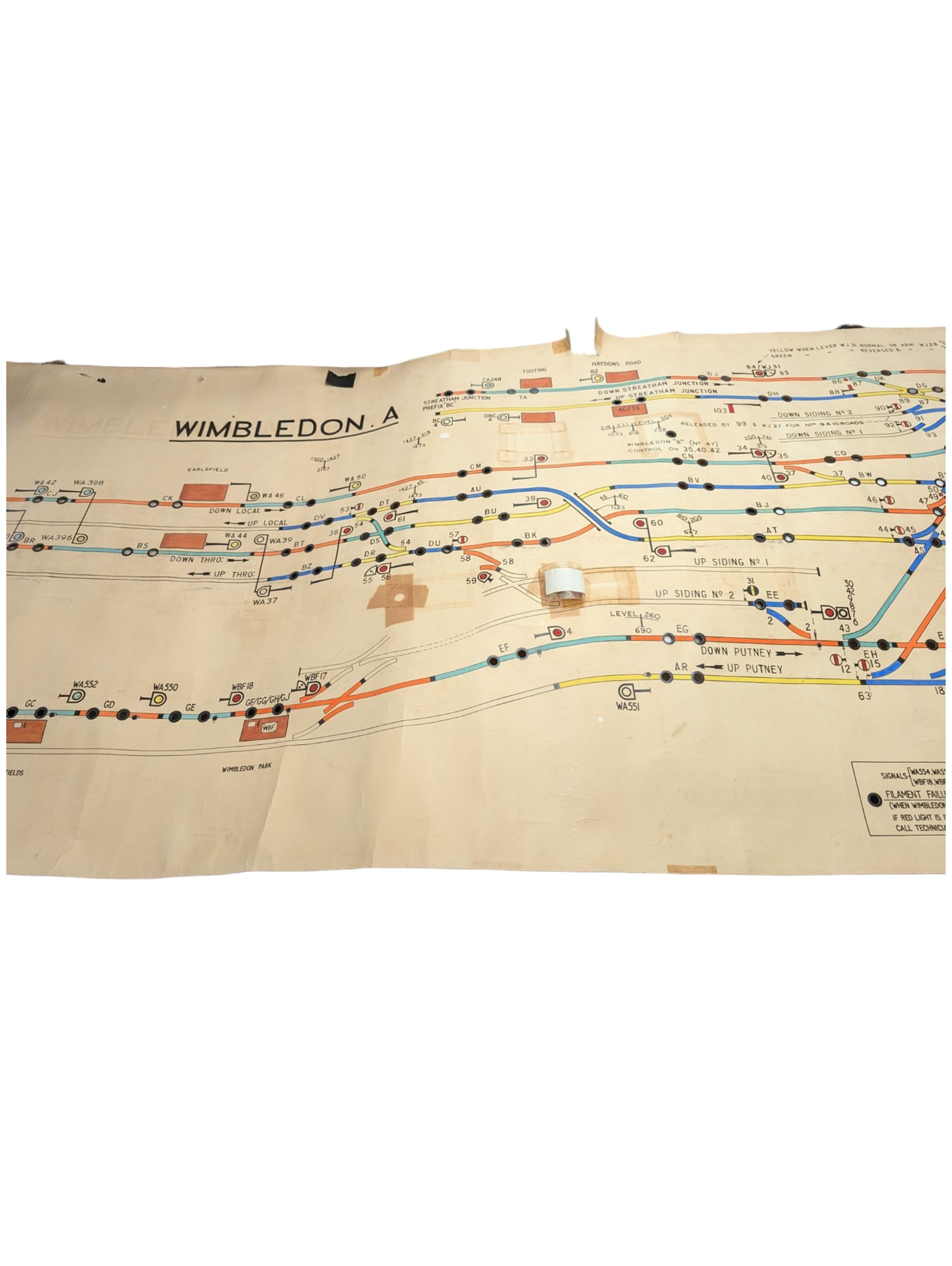 Collection of railway signal maps and similar, including a Wimbledon example, approx 350cm long, together with a collection of book pages depicting images of locomotives