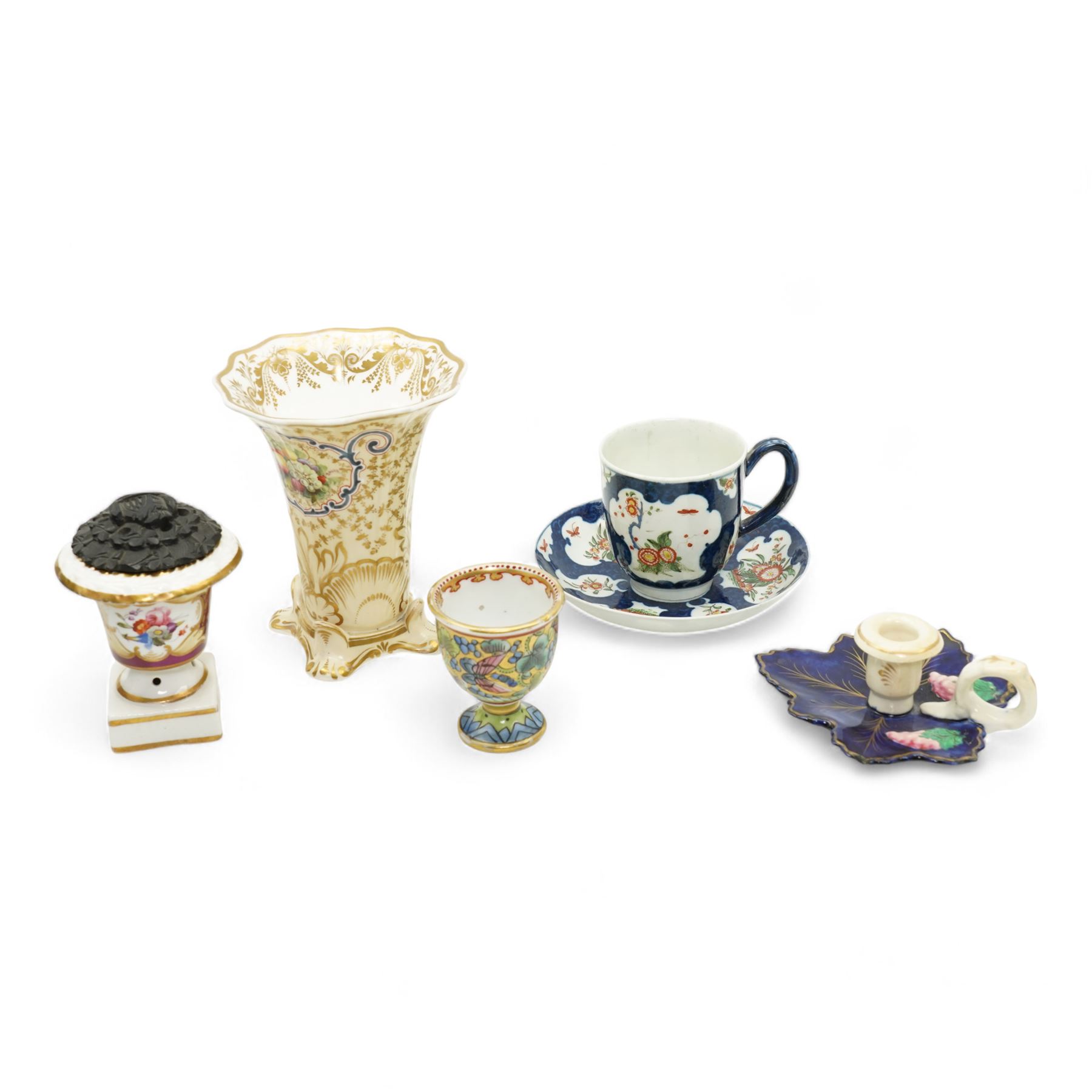 19th century porcelain campana form pot pourri vase, with associated cover, probably Derby, 18th century Worcester scale blue ground kakiemon coffee cup and saucer, c1770, Copeland and Garrett cylindrical vase with flared rim and four scroll supports, H12cm, porcelain chamber stick, modelled as a leaf with grapes flanking the ring handle and a Chinese Export egg cup 
