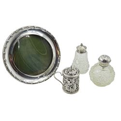 Early 20th century Chinese silver condiment, with pierced and embossed Dragons chasing a flaming pearl decoration, silver mounted cut glass scent bottle, the lid decorated with cherubs and pepperette and a silver photograph frame, all hallmarked