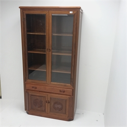 Chinese rosewood glazed display cabinet, two bevel edge glazed doors enclosing three shelves, above single drawer and two cupboards, plinth base, W93cm, H181cm, D36cm 