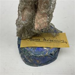 Anna Meszaros Hungary - hand made needlework figurine of an Angel with metallic lace full length dress and open threadwork wings; on moulded base H45cm Auctioneer's Note: Anna Meszaros came to England from her native Hungary in 1959 to marry an English businessman she met while demonstrating her art at the 1958 Brussels Exhibition. Shortly before she left for England she was awarded the title of Folk Artist Master by the Hungarian Government. Anna was a gifted painter of mainly portraits and sculptress before starting to make her figurines which are completely hand made and unique, each with a character and expression of its own. The hands, feet and face are sculptured by layering the material and pulling the features into place with needle and thread. She died in Hull in 1998.