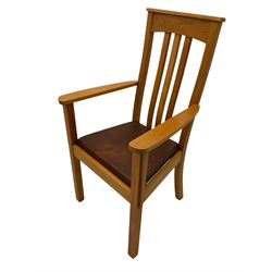 Pair of solid oak Arts and Crafts style carver chairs, inlay to top rail, drop in seat